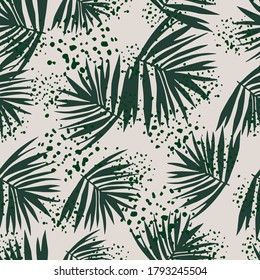 Random tropical leaves seamless pattern. Dark green foliage bush on grey background with splashes. Perfect for wallpaper, textile, wrapping paper, fabric print. Vector illustration.
