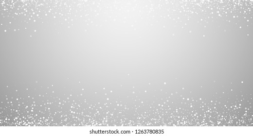 Random white dots Christmas background. Subtle flying snow flakes and stars on light grey background. Amusing winter silver snowflake overlay template. Terrific vector illustration.