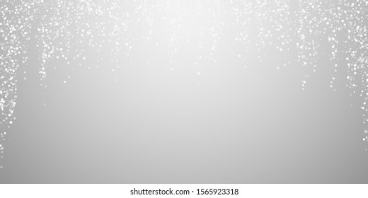 Random white dots Christmas background. Subtle flying snow flakes and stars on light grey background. Attractive winter silver snowflake overlay template. Glamorous vector illustration.