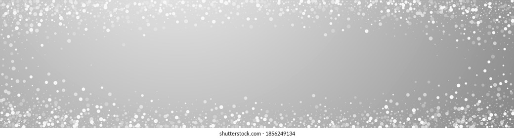 Random white dots Christmas background. Subtle flying snow flakes and stars on grey background. Brilliant winter silver snowflake overlay template. Shapely panoramic illustration.