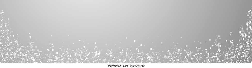 Random white dots Christmas background. Subtle flying snow flakes and stars on grey background. Bold winter silver snowflake overlay template. Symmetrical panoramic illustration.