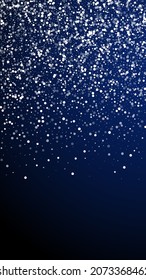 Random white dots Christmas background. Subtle flying snow flakes and stars on dark blue background. Appealing winter silver snowflake overlay template. Amusing vertical illustration.