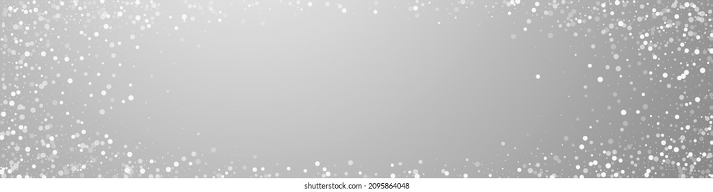 Random white dots Christmas background. Subtle flying snow flakes and stars on grey background. Captivating winter silver snowflake overlay template. Amusing panoramic illustration.