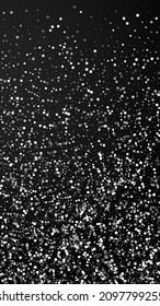 Random white dots Christmas background. Subtle flying snow flakes and stars on black background. Appealing winter silver snowflake overlay template. Divine vertical illustration.