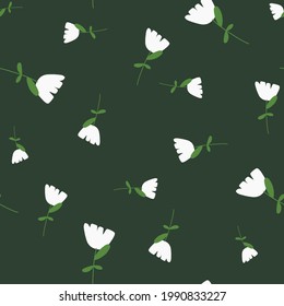 Random white simple flowers shapes seamless pattern in doodle style. Green background. Natural ornament. Vector illustration for seasonal textile prints, fabric, banners, backdrops and wallpapers.