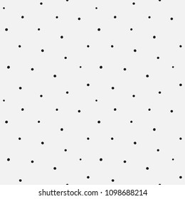 Randomly placed polka dots, hand drawn spots seamless vector pattern. Scattered big and small circles, points in various sizes. Monochrome retro background. Decorative black and white design tiles.
