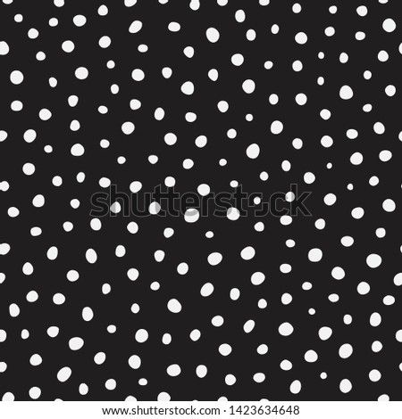 Randomly placed polka dots, hand drawn spots seamless vector pattern. Scattered big and small circles, points in various sizes. Monochrome retro background. Decorative black and white design tiles.