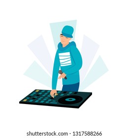 Rap style satisfied smiling disk jockey with microphone in hand mixing tracks at turntable on white background