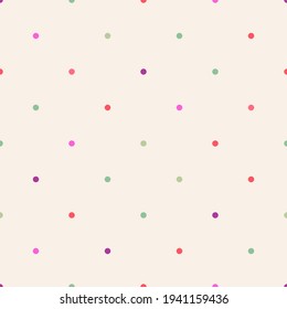 Rare small polka dots of different colors on a beige background. Seamless pattern for any use.