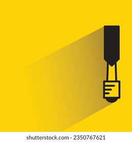 rasp tool with shadow on yellow background