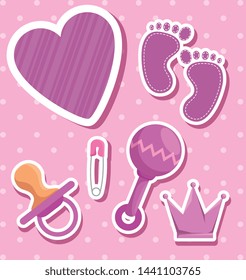 rattle with footprint and pacifier with crown decoration