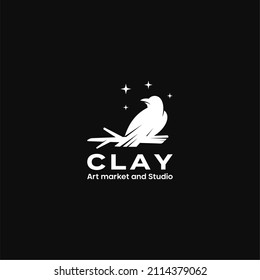 Raven on a tree branch at night logo design premium vector