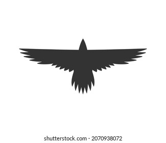 Raven silhouette. Flying crow. Bird shape logo. Vector illustration image.
