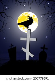 raven sitting on a cross