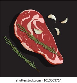 Raw ribeye steak with rosemary and garlic