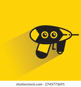 ray gun icon with shadow on yellow background