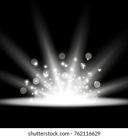 Rays of light with sparks, light effect. star burst on black background, white color