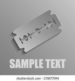 Razor blade on a gray background
