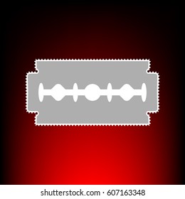 Razor blade sign. Postage stamp or old photo style on red-black gradient background.