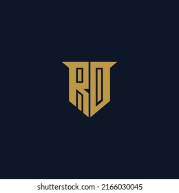 RD Logo monogram with emblem shield shape design isolated gold colors on black background