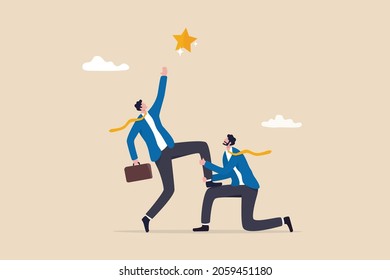 Reach for the star, teamwork or support to achieve business goal, partnership or manager mentorship to help success concept, businessman manager support colleague to stand on his knee to reach target.