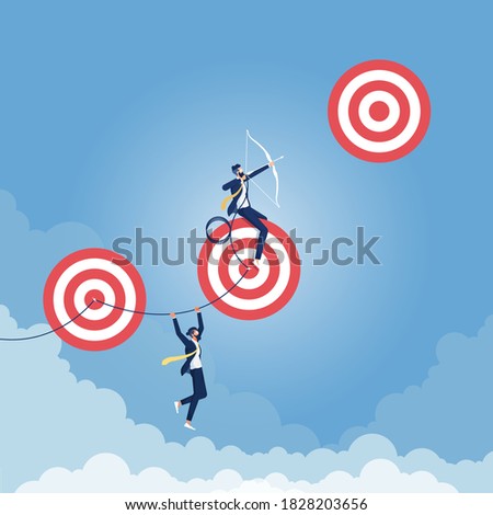 Reaching Higher Targets Concept, Excellent businessman taking aim on a high risk target