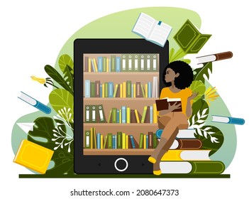 Read the book online. A young African American girl reads a book while sitting on large books near a large display case with an e-book. Internet library. Reading concept.