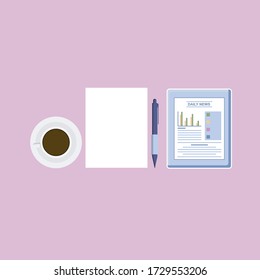 read news on the website. Online newspaper media. There is a bar chart inside with information. and a cup of warm drink, pen and paper beside it.