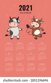 Ready-to-print vertical wall calendar for 2021 with a cute bull, cow or ox, the symbol of 2021 according to the Chinese calendar. The week starts on Sunday. Printable stock calendar template