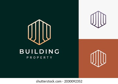 Desarrollador inmobiliario o logotipo inmobiliario en forma lujosa y futurista
