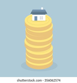 Real estate. House on stack of coins.