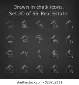 Real estate icon set hand drawn in chalk on a blackboard vector white icons on a black background.