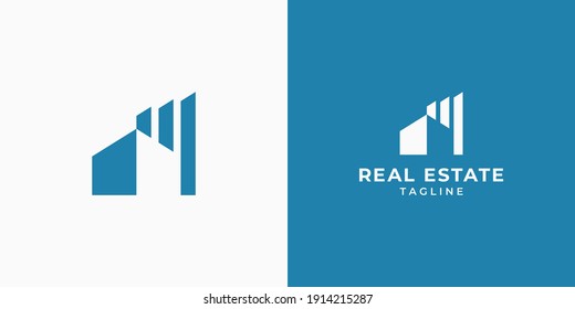 Real estate logo design. House and building vector illustration for real estate business or corporate. House logo with graph on white and blue color. Simple and modern symbol for construction company.