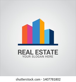Real estate logo design vector with flat color concept. Clean and modern design of real estate and city building logo template.