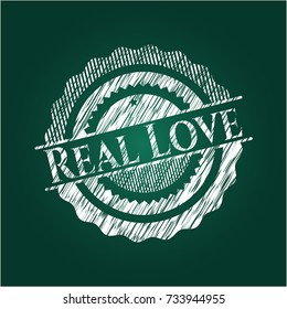 Real Love chalk emblem written on a blackboard