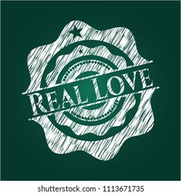 Real Love chalkboard emblem written on a blackboard