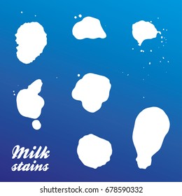 Real milk stains - set of silhouettes. Isolated on blue background. Vector. Eps 10