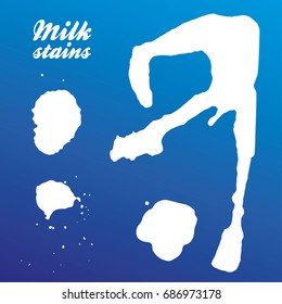 Real milk stains - set of silhouettes. Isolated on blue background. Vector. Eps 10