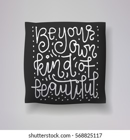 Realistic 3d throw pillow vector model with hand drawn print on a black background. Apartment interior design element. "Be your own kind of beautiful" - hand drawn lettering inscription.