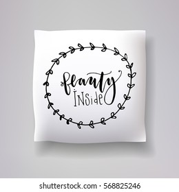 Realistic 3d throw pillow vector model with hand drawn print. Apartment interior design element. "Beauty inside" - hand drawn lettering inscription.