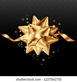 Realistic beautiful gold bow isolated on transparent background. Gold ribbon and bow. Golden sparks, light. EPS10 vector.