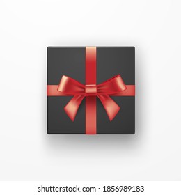 Realistic black gift box with red ribbons over white background. Christmas design vector illustration