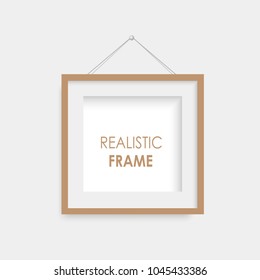 Realistic brown photo frame hanging. Vector