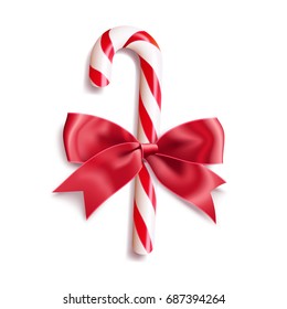 Realistic christmas candy cane with red satin bow knot. Vector illustration icon isolated on white.