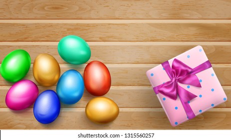 Realistic colored Easter eggs, tasty cake and beautiful gift box with bow on wooden planks