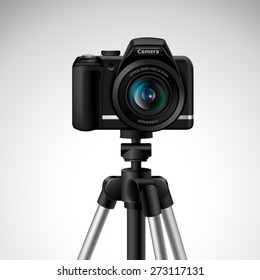 Realistic digital photo camera on tripod isolated on white background vector illustration