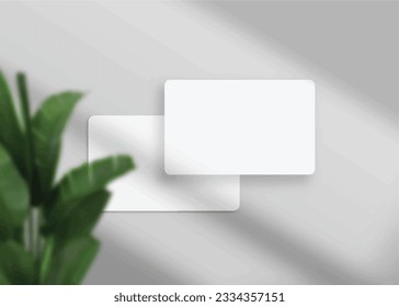 Realistic elegant and minimalist white blank business card mockup. 3D vector illustration. Windows shadow and leaves overlay on isolated background.