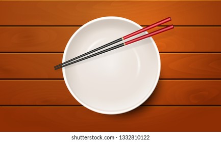 Realistic empty bowl on wooden table with asian chopsticks