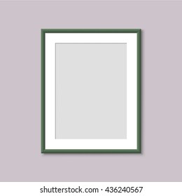 Realistic Empty Green Picture Frame. Realistic vertical frame for paintings or photographs hanging on the wall