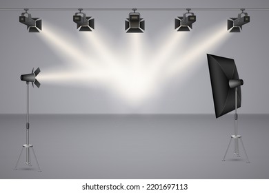 Realistic empty photo studio with, lamps, flash spotlights on gray backdrop, background with modern equipment for professional photography. 3d vector illustration